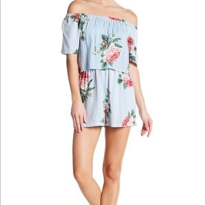 Blue Off-the-shoulder Floral Romper by Angie